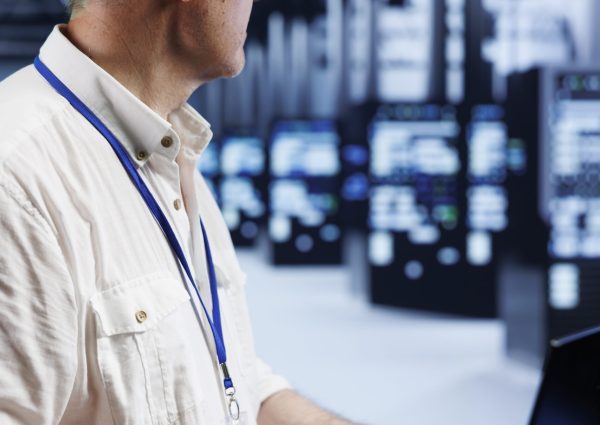 Certified professional uses laptop, setting up high bandwidth dedicated multiplayer gaming servers in cloud computing business to accommodate traffic from worldwide locations and avoid low ping rates